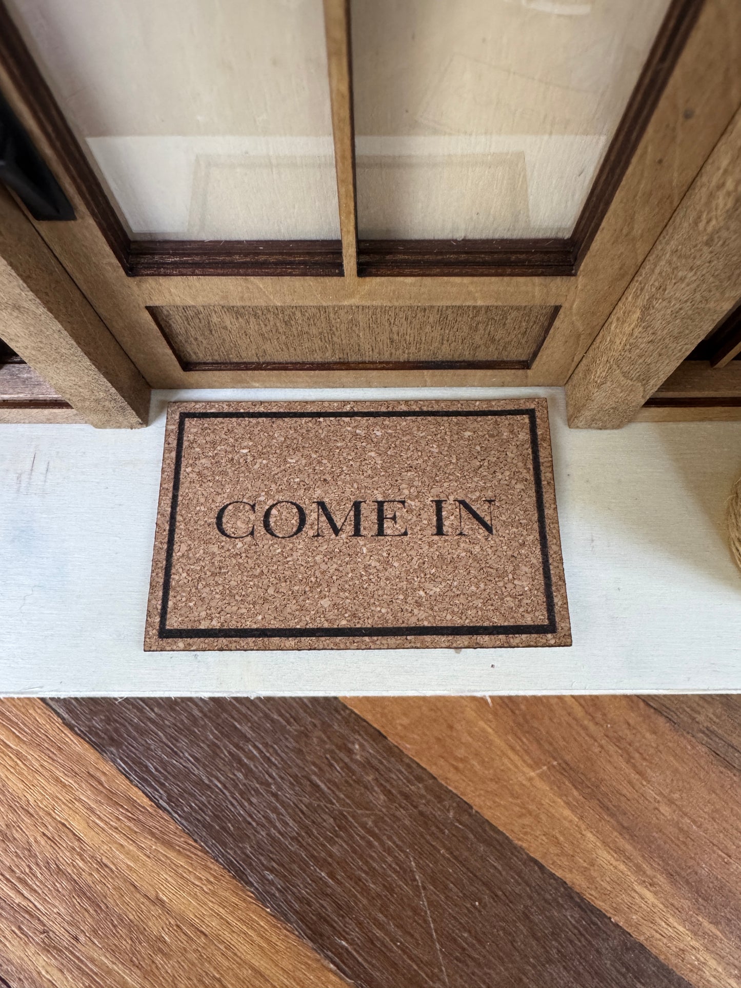 Miniature "Come In" front door mat, close-up detail for dollhouse