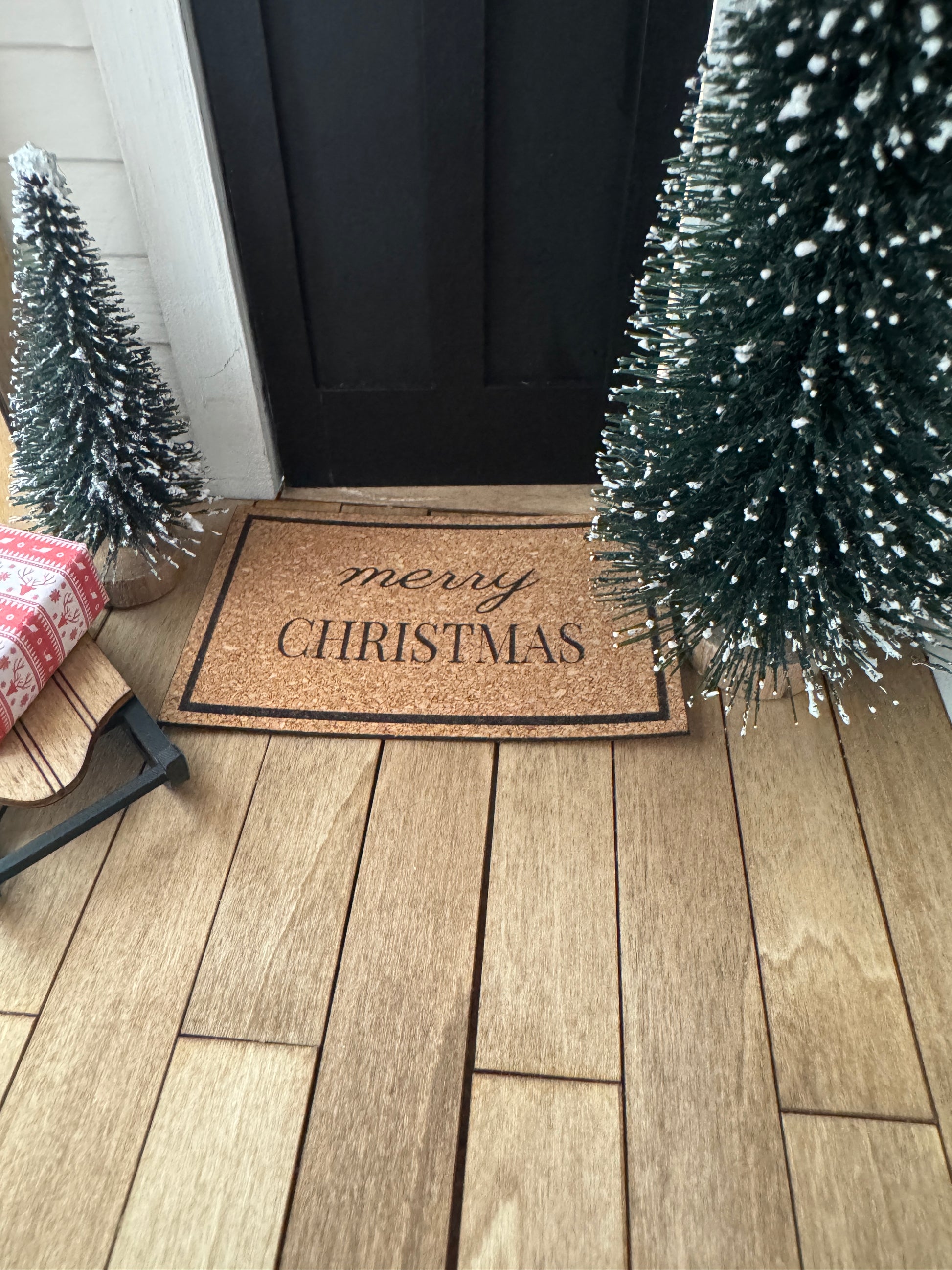 Miniature "Merry Christmas" front door mat, close-up detail for dollhouse