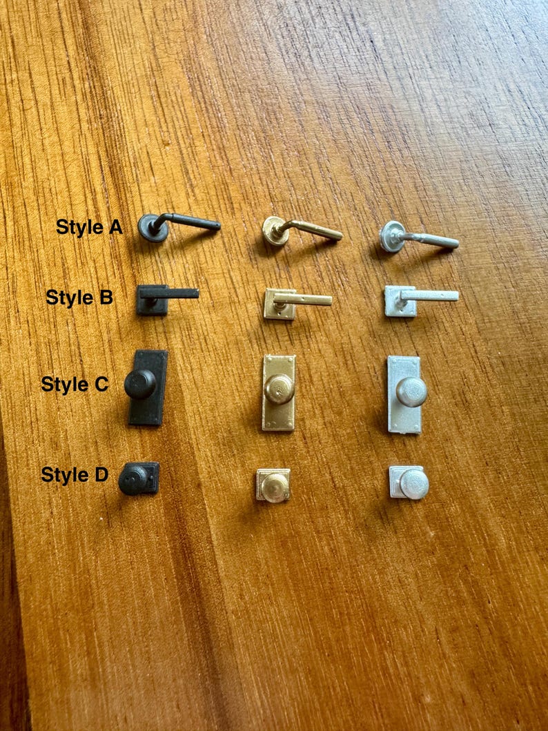 Miniature interior door handles, close-up detail, 1:12 scale dollhouse hardware